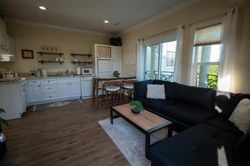 a living room with a couch and a table at BV Guest House With Pool And Spa in Rancho Cucamonga