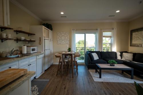 a kitchen and living room with a couch and a table at BV Guest House With Pool And Spa in Rancho Cucamonga