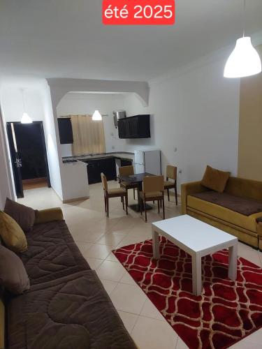 a living room with a couch and a table at Del Mar Plaza in Tangier