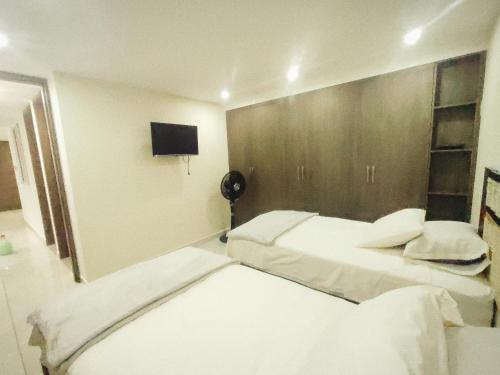 Postel nebo postele na pokoji v ubytování Bonito Apartamento Amoblado en la Mejor Zona