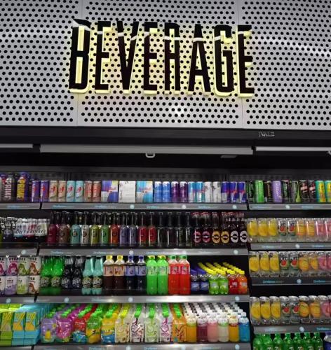 a store shelf filled with different types of drinks at Fouka Bay North Coast 2BRs Modern Style Serviced Apartment with Open Pool & Sea View in Marsa Matruh