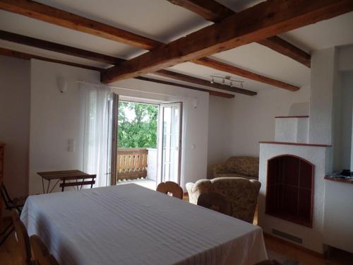 a living room with a bed and a fireplace at Holiday home with 2 bedrooms in Zgornja Kungota