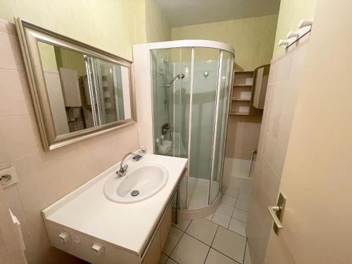a bathroom with a sink and a shower at Appartement Cozy, 4 Pers, Centre-Ville, Proche Plage et Commerces - FR-1-92-877 in Les Sables-dʼOlonne
