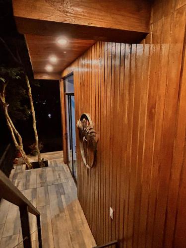 a wooden wall with a bird on it at Casa Fénix Zen Oasis Del Bosque in Calima