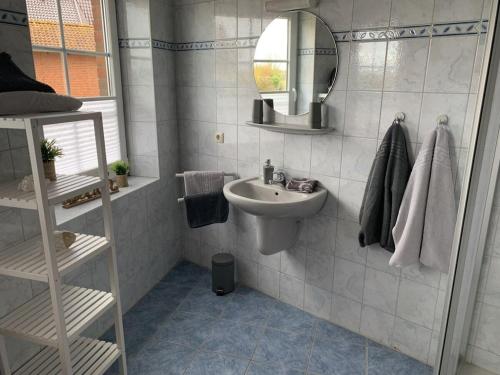 a bathroom with a sink and a mirror at Holiday apartment with 2 bedrooms in Hasselberg