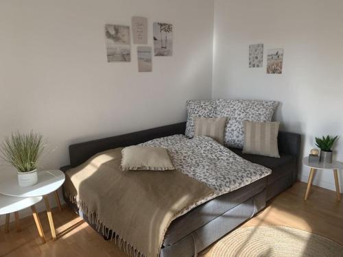 a bed in a room with a couch and a table at 1-bedroom holiday apartment in Hasselberg