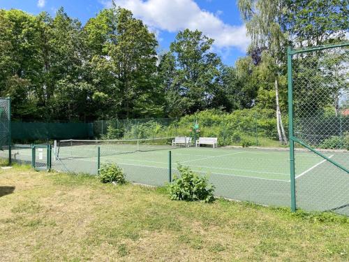 a tennis court with two tennis courts at 4 person holiday home in Vaxholm in Vaxholm