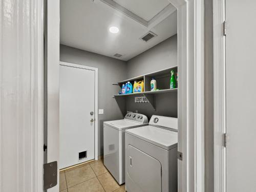 a laundry room with two washer and dryer at Kimberly Surprise in Surprise