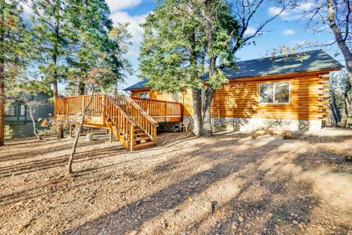 a log cabin with a staircase in front of a house at Crescenta pines log cabin #2346 in Big Bear Lake