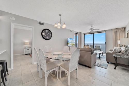 a living room with a table and a couch at Stunning Views, 3BD/2BA w/ Private Balcony in Orange Beach