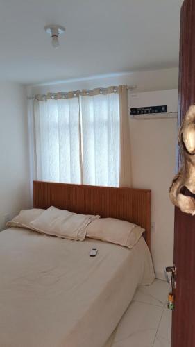 Ένα ή περισσότερα κρεβάτια σε δωμάτιο στο Paraíso no Tabajaras