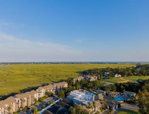 an aerial view of a resort with a field and houses at Sea Palms Resort St Simons Island in Saint Simons Island