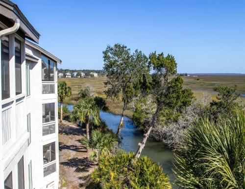 an aerial view of a river next to a building at Sea Palms Resort St Simons Island in Saint Simons Island