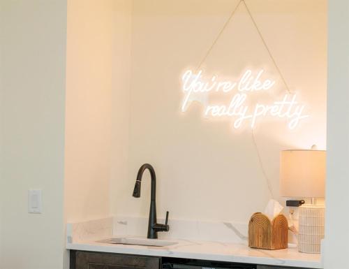 a kitchen with a sink and a sign that says youre like really party at Sea Palms Resort St Simons Island in Saint Simons Island