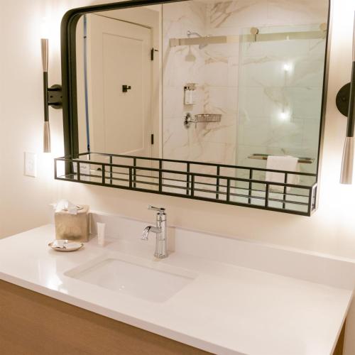 a bathroom with a sink and a mirror at Sea Palms Resort St Simons Island in Saint Simons Island