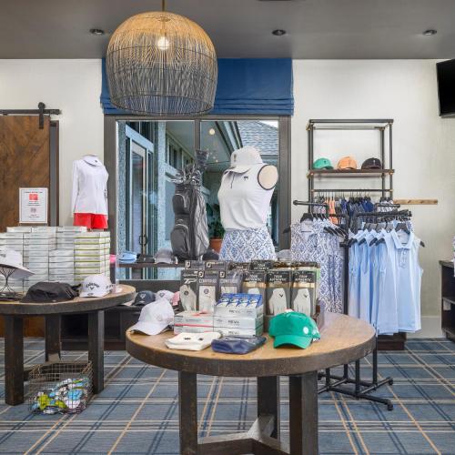 a store with two tables with clothes on display at Sea Palms Resort St Simons Island in Saint Simons Island