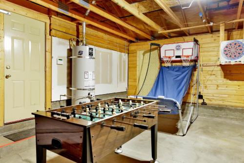 a room with a foosball table and a basketball hoop at Crescenta pines log cabin #2346 in Big Bear Lake