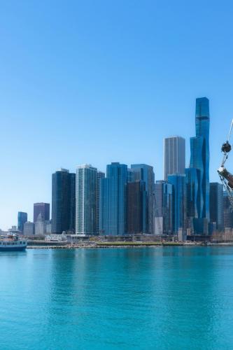a view of a city skyline from the water at Luxurious Lincoln Park Home with Gourmet Kitchen in Chicago