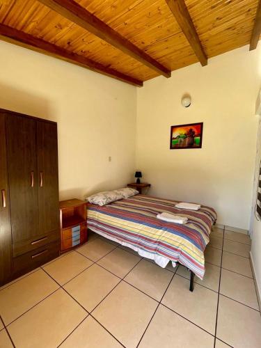 Postel nebo postele na pokoji v ubytování Tio Jhony's Cottage