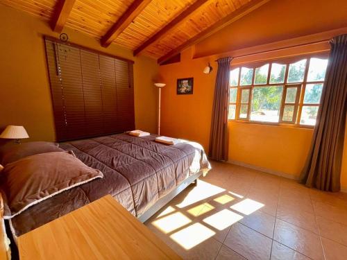 Postel nebo postele na pokoji v ubytování Tio Jhony's Cottage