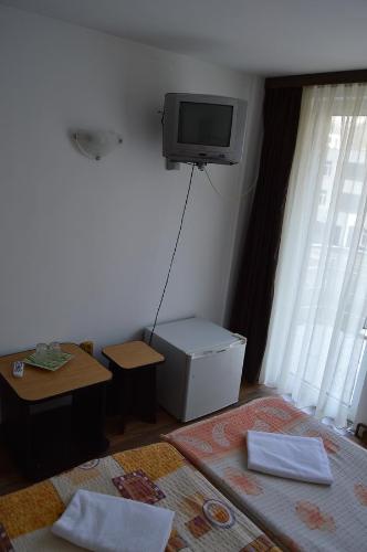 En tv och/eller ett underhållningssystem på Pensiunea Argus