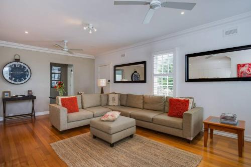 a living room with a couch and a chair at Sorrento Darling by Ready Set Stay in Sorrento