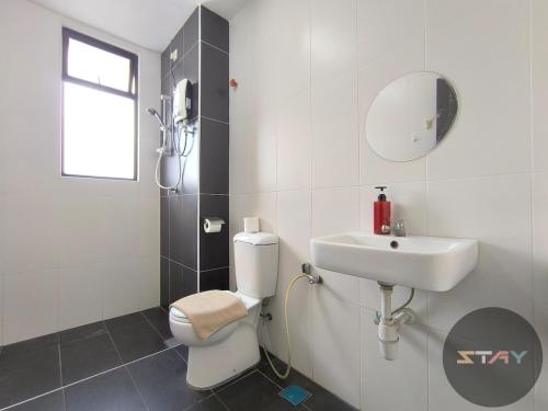 a bathroom with a toilet and a sink at The Garden 2Bed Cozy Vibrant Family Retreat BySTAY in Skudai