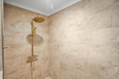 a bathroom with a shower with a glass door at 630 New Haven - Dolphin Pointe in Fripp Island