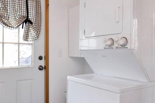 a white refrigerator in a kitchen with a window at Moulin rouge #2055 in Big Bear Lake