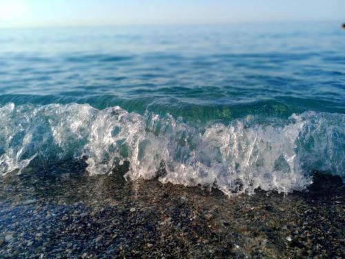 a breaking wave on the shore of the ocean at Apartment in Liguria near Toirano Caves in Vezzi Portio