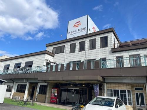 a white car parked in front of a building at Hotel Nissin Kaikan - Vacation STAY 02342v in Shiso