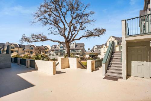 a balcony with stairs and a tree and houses at 630 New Haven - Dolphin Pointe in Fripp Island