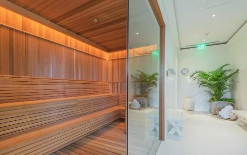 a bathroom with a shower with wood paneling at 4 Bedroom Wilson Village Home 5036 in Bluffton