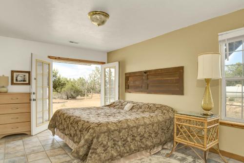 a bedroom with a bed and a window at Ranchette Ponderosa - The Freemont #2 at Wind Walker Homestead in Spring City
