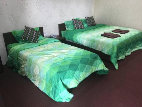 Ένα ή περισσότερα κρεβάτια σε δωμάτιο στο Samui platinum hotel