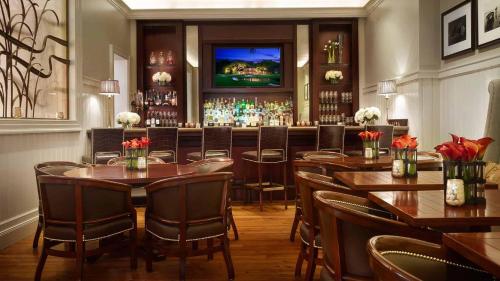 a restaurant with tables and chairs and a bar at Lagoon View 2 Bedroom Wilson Village Home 5037 in Bluffton