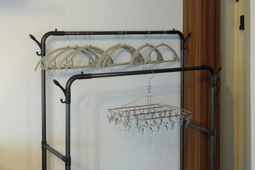 a chandelier hanging from a metal rack at Aonoyado 碧の宿べっぷ駅前町 in Beppu