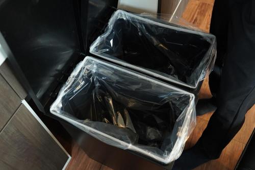 two plastic bins sitting on top of a table at Aonoyado 碧の宿べっぷ駅前町 in Beppu