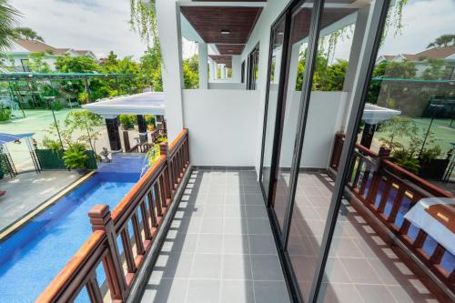 a view of the pool from the balcony of a house at Pich Kunthea Angkor Resort in Phumĭ Kruŏs