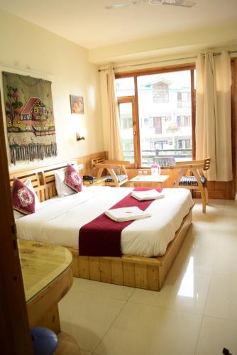 Ένα ή περισσότερα κρεβάτια σε δωμάτιο στο Noel Home's Manali