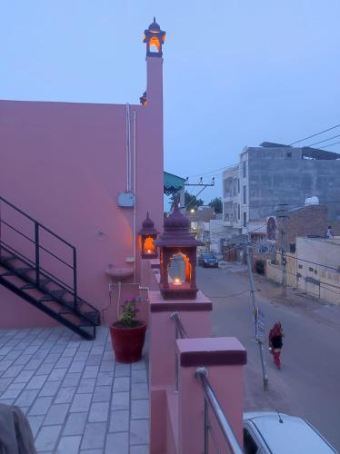a building with a light on the side of it at Ardas Villa Bikaner - Heritage Luxury Boutique Stay in Bikaner