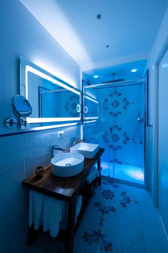 a bathroom with a sink and a shower at Villa Anfitrite in Positano