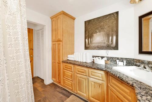 a bathroom with a sink and a mirror at Conklin paradise #1993 in Big Bear Lake