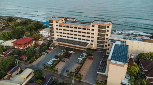 an aerial view of a hotel and the ocean at Awesome Hotel in San Juan