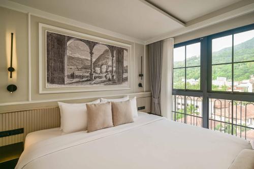 Ένα ή περισσότερα κρεβάτια σε δωμάτιο στο Chateau Du Village Patong