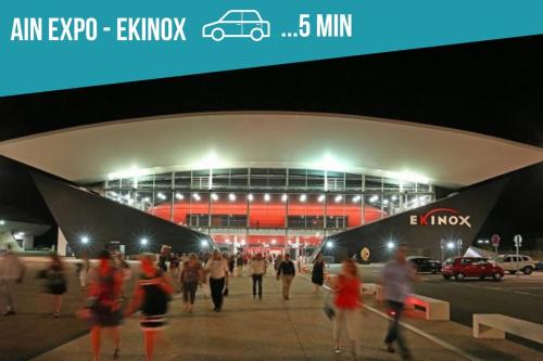 people walking in front of a soccer stadium at night at Le nid douillet - Centre Ville - 3 étoiles in Bourg-en-Bresse