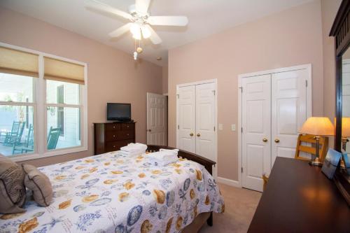 a bedroom with a bed and a ceiling fan at 364 Wahoo Dr in Fripp Island