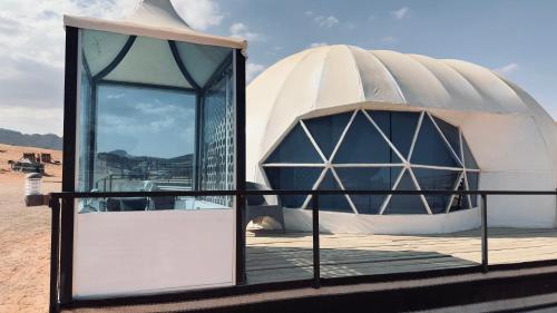 a domed observatory with a dome in the desert at The bubble camp in Aqaba