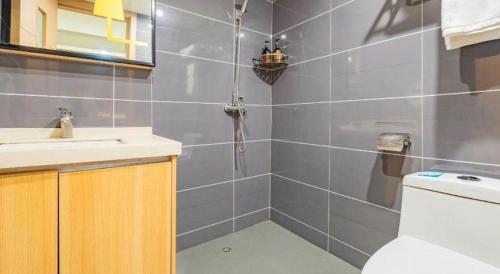 a bathroom with a toilet and a sink at IU Hotel Chengdu High-Tech Zone Longhu Times Street in Chengdu