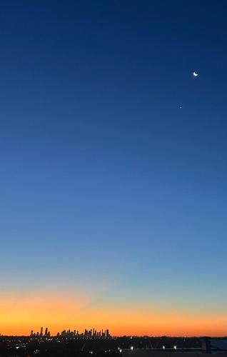a view of the city at sunset at Penthouse with Stunning Melbourne Skyline View in Bulleen